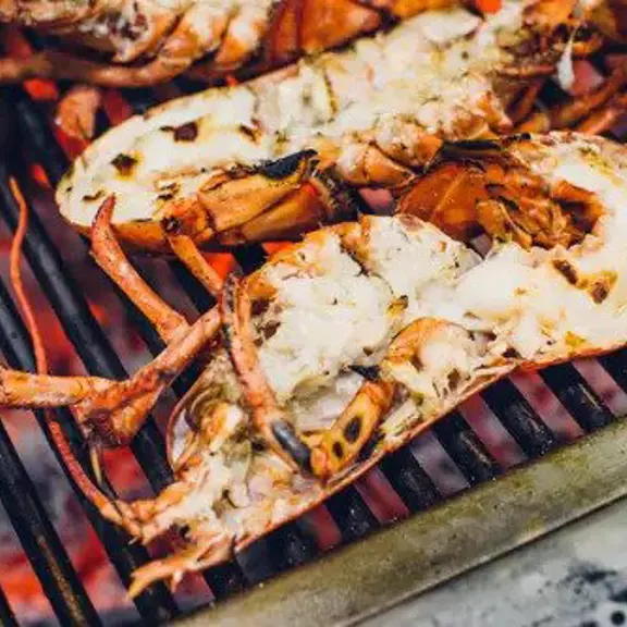 Lobster being cooked on a grill