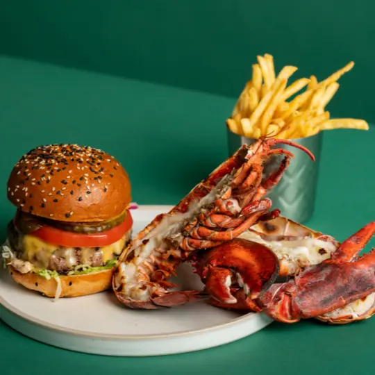 Burger & Lobster combo on green background